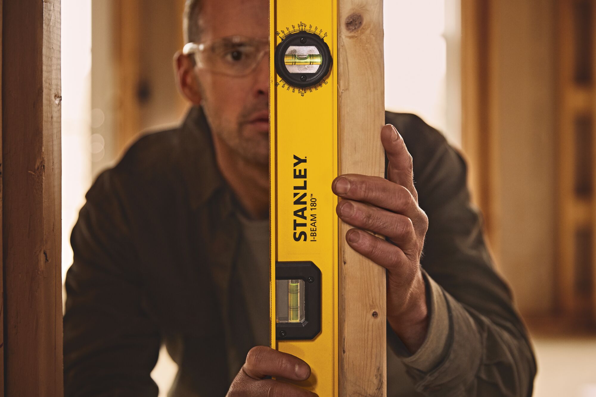 24 inch I beam 180 level being used to level piece of wood.