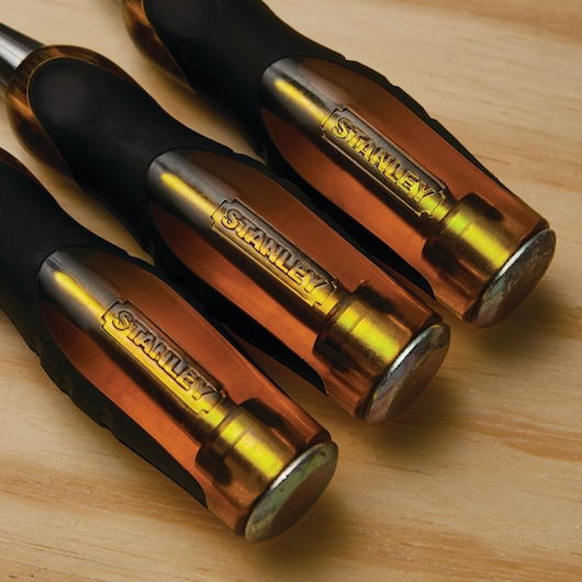 Sturdy grip feature of a 3 piece fat max thru-tang wood chisel.