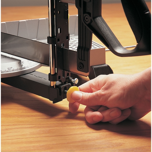 Adjustable angle clamping miter box with 22 inch saw in use.