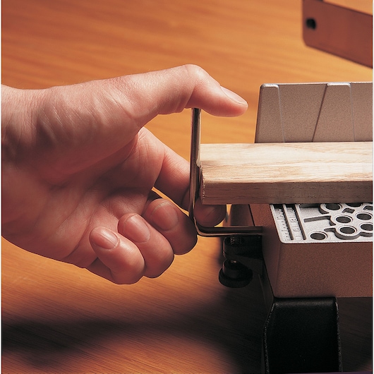 Adjustable angle clamping miter box with 22 inch saw being used.