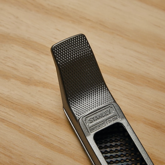 Metallic grey die cast alloy body feature in 10 inch surform plane type regular cut blade.