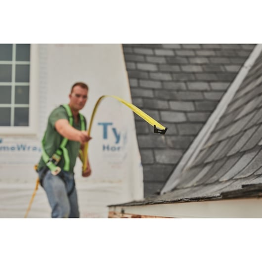 25 foot FATMAX classic tape measure being used by a person to measure distance.