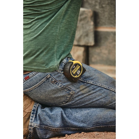 25 foot FATMAX classic tape measure being used by a person.