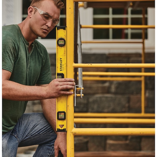 24 inch I beam 180 level being used to level.