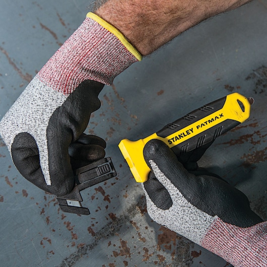 Fatmax double sided replaceable head pull cutter with its head being replaced.