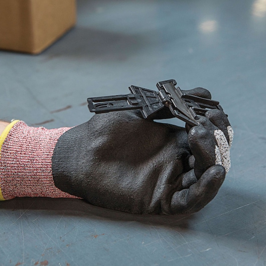 Fatmax double sided pull cutter replaceable blade head in a person's hand.