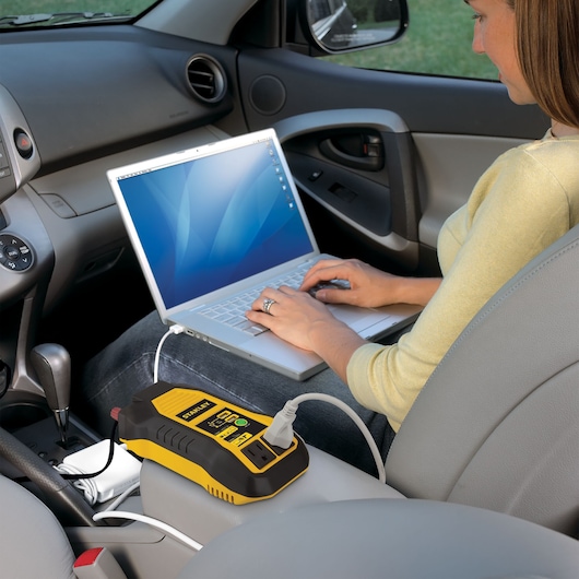 500 watt power inverter with USB being used to charge a car engine.