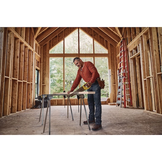 15 inch TRADE CUT Panel Saw being used for cutting wood by person.